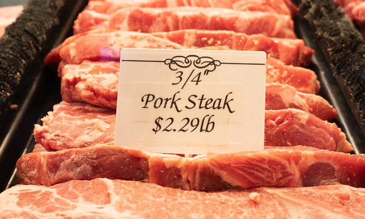 Pork steaks laid out on display